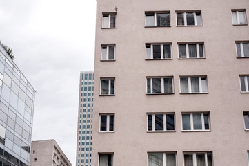 ; view of skyscraper windows; old city in the reflection of a new building;  mixture of glass, metal and concrete;