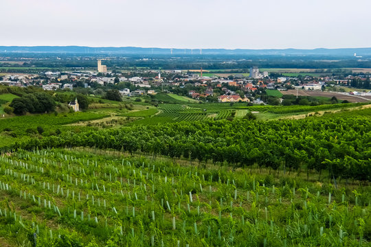 View of small austrian town and green fields