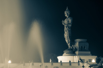  Important day in Buddha religion concept. Big buddha statue in the evening at Buddha park center in Nakorn prathom ,Thailand