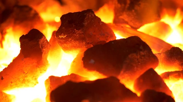 UHD closeup shot of the burning coal forge at blacksmith shop