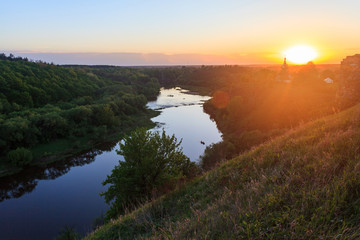 beautiful bright sunset on forest river