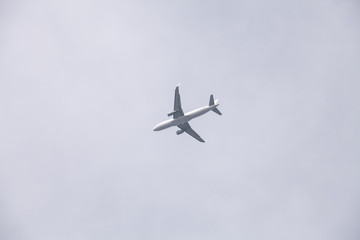 Passenger Airplane flying under the sky