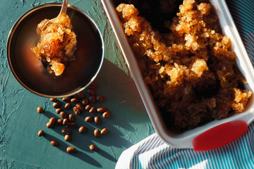 Form for dessert with coffee ice, napkin and saucers for dessert closeup. Sicilian granite