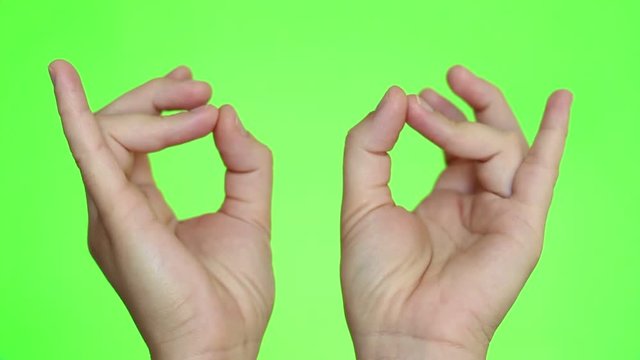 Mudra. Yoga hand position. Hands close-up. Chroma key background. Green Screen. Isolated