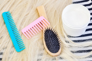 Comb, wig and goji cream mask for hairs.Hair product concept