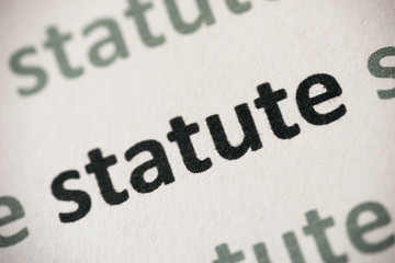 word statute printed on paper macro