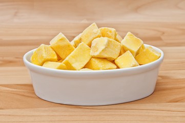 Cut of mango cut to cubes isolated
