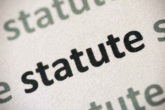 word statute printed on paper macro