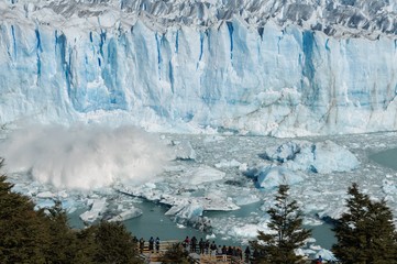 Tourists standing on the viewing platform of Perito Moreno Glacier, El Calafate, Patagonia,...