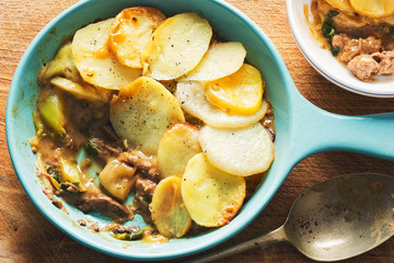 Peppercorn beef hotpot. Beef and roasted onions in peppercorn sauce topped with sliced potatoes