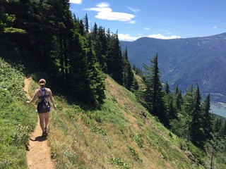 Summer Hikes in Oregon. Girl hiking in mountains or forest with summer cloths. Hobbies that are...