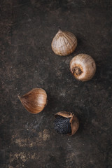 Black garlic with rustic background