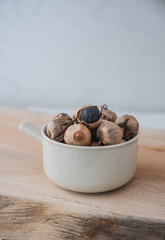 Black garlic with rustic background