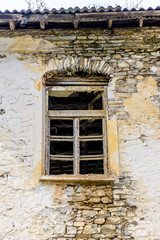 Fototapeta na wymiar Window of abandoned old house