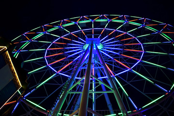 Gelendzhik, Russia - June 26, 2018: Ferris wheel in an amusement park at night time