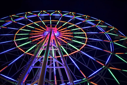 Gelendzhik, Russia - June 26, 2018: Ferris wheel in an amusement park at night time