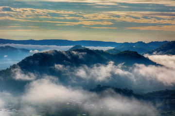 Forests, mountains, fog and golden cloudy sky are landscape in Thailand.