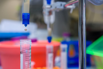 Liquid dripping through a filter column with a drop in mid air transferring from column to collection tube.