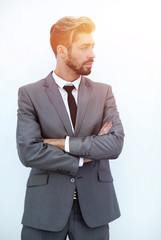 business man with arms crossed in a white background