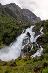 Obraz premium Small waterfall in Norway. Briksdalsbreen.
