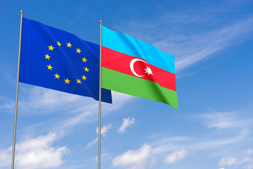 European Union and Azerbaijan flags over blue sky background.