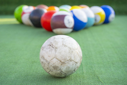Ground pool snookball game with football balls on green grass