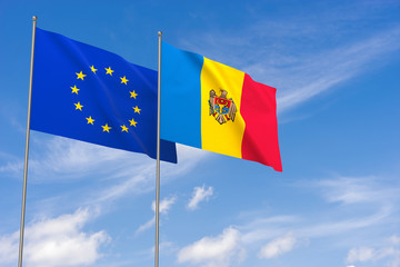 European Union and Moldova flags over blue sky background.