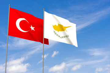 Turkey and Cyprus flags over blue sky background.