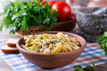 Cooked green beans in sour cream with greens in a plate