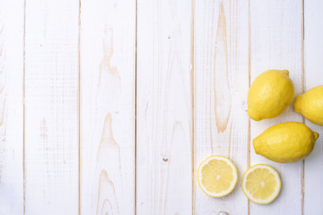 Lemon on white wooden table