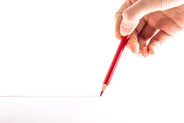 hand with the red pencil on a white background