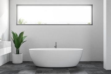Fototapeta na wymiar White minimalistic bathroom interior, window