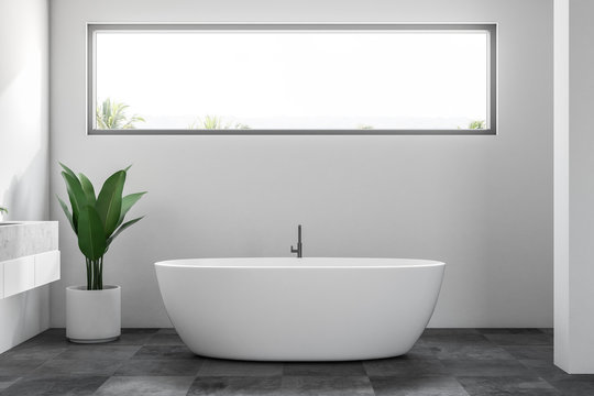 White minimalistic bathroom interior, window