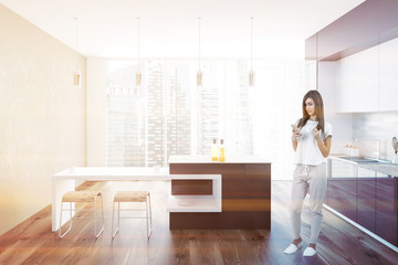 Brown and white loft kitchen interior, woman