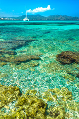 Beautiful transparent clear sea water at seaside of Cala Millor on Mallorca island, Spain