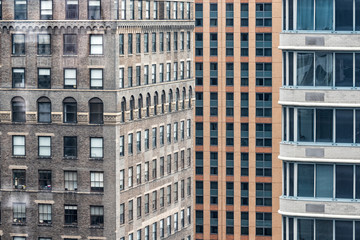Closeup pattern of modern skyscraper buildings architecture in New York City NYC aerial view through window, vertical lines, windows