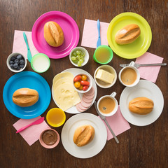 Colourful breakfast table for a whole family of five