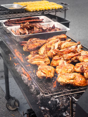 Variety of Meat Grilling on an Open Fire