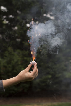 Hand holding firecracker