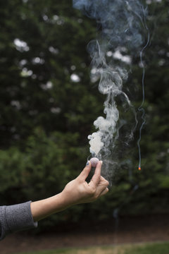 Hand holding firecracker