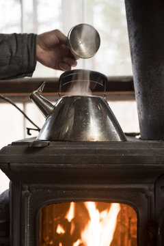 Kettle boiling on woodstove