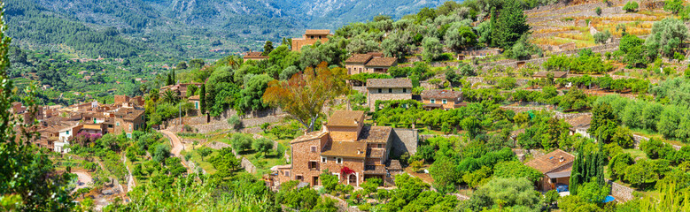 Fototapeta na wymiar Old village of Fornalutx in beautiful mediterranean mountain landscape, Majorca Spain, panorama view