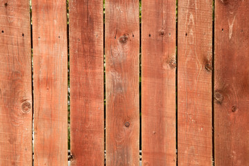 Old wood background with shabby red paint.close-up