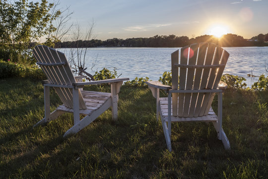 To Outdoor Chairs On A River With A Relaxing View