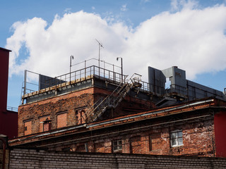 Fototapeta na wymiar industrial building on the sky background