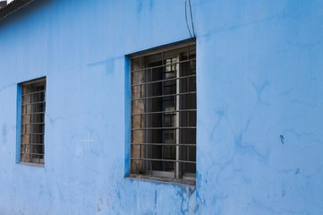Fototapeta na wymiar A couple of windows and a light blue wall (Kunming, Yunnan, China)