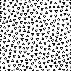 Fototapeta na wymiar Abstract seamless black and white pattern of hand drawn doodle triangle elements. Scandinavian design style. Vector illustration for textile, backgrounds etc