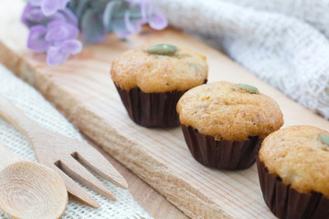 Homemade bakery banana muffin on wood table.