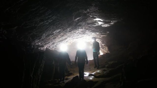 Children go through the cave