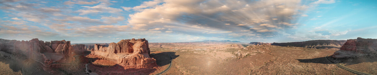 Panoramic sunset aerial view of Arches National Park from helicopter, Utah